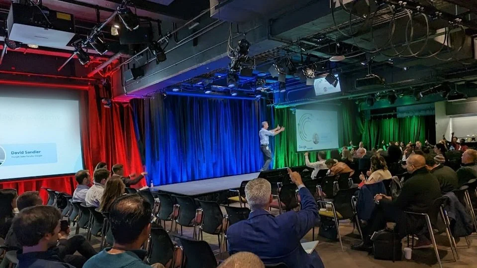 David Sandler presenting on stage