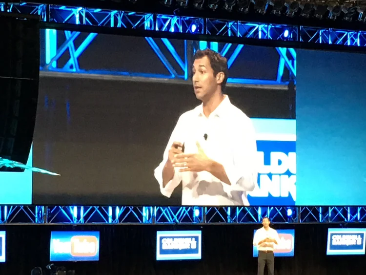 David keynoting on a major stage with jumbotron